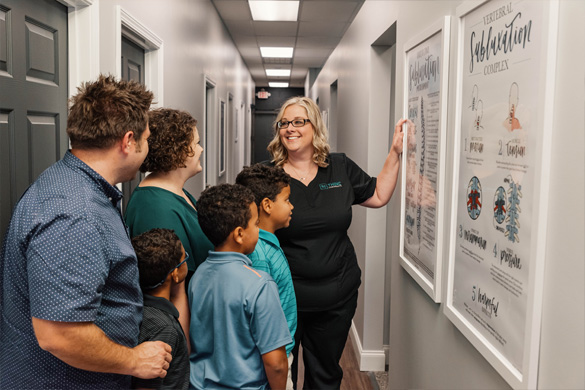 Chiropractic Greenville SC Kathryn Gray With Patients Chiropractic Greenville SC Kathryn Gray With Patients