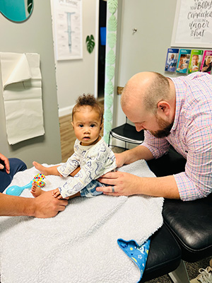 Chiropractor Greenville SC Zane Gray With Baby Patient