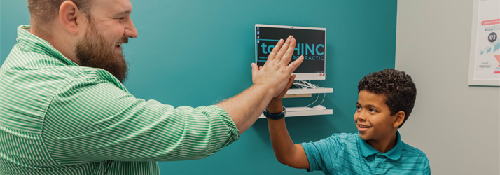 Chiropractor Greenville SC Zane Gray With Child Patient