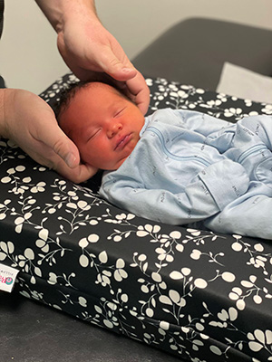 Chiropractor Greenville SC Zane Gray With Infant Patient